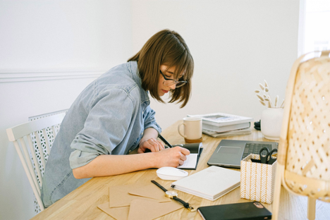 Woman working in small home office